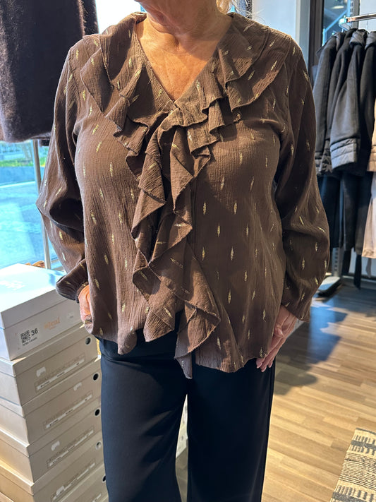 Puuvillainen röyhelöpusero