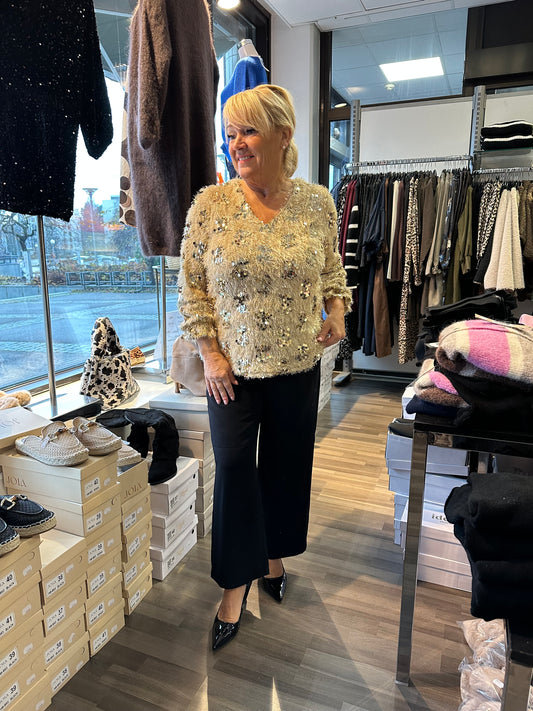 Paljettinen höyhenpusero kulta