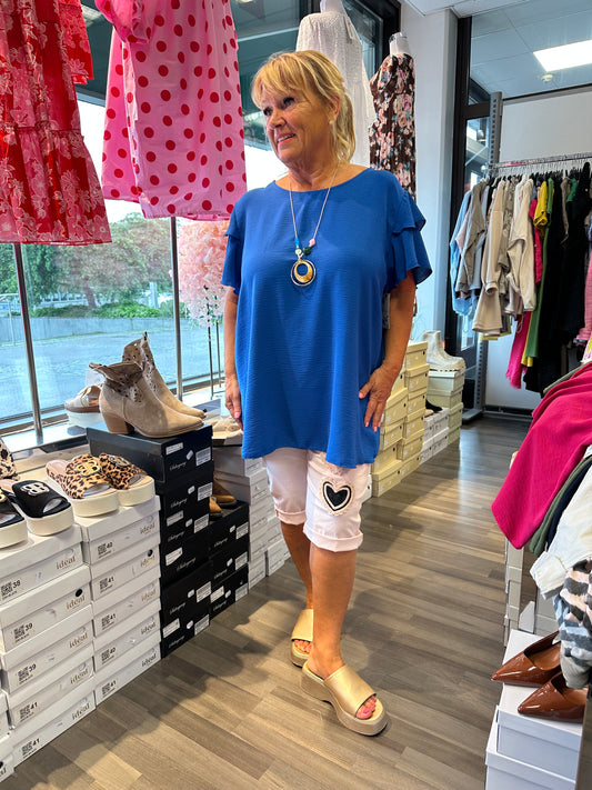 Plussize pusero röyhelöhihoilla (4 väriä)
