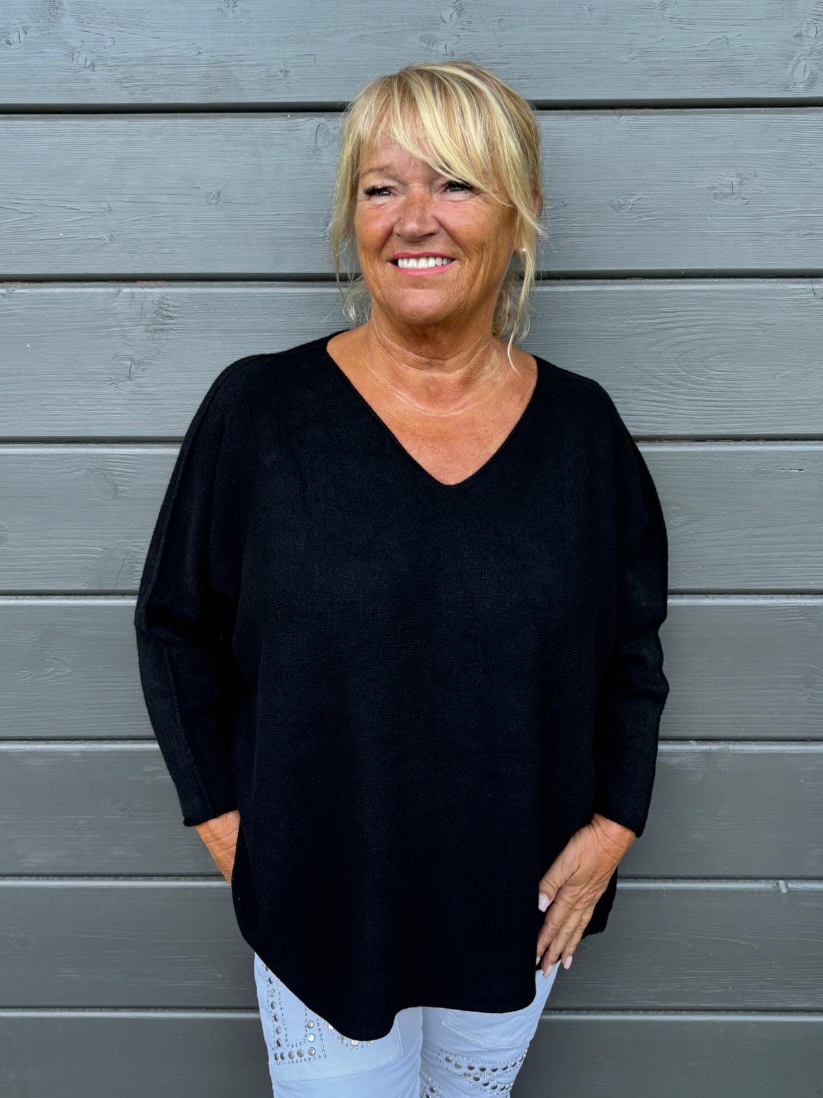 Reilumpi neule musta