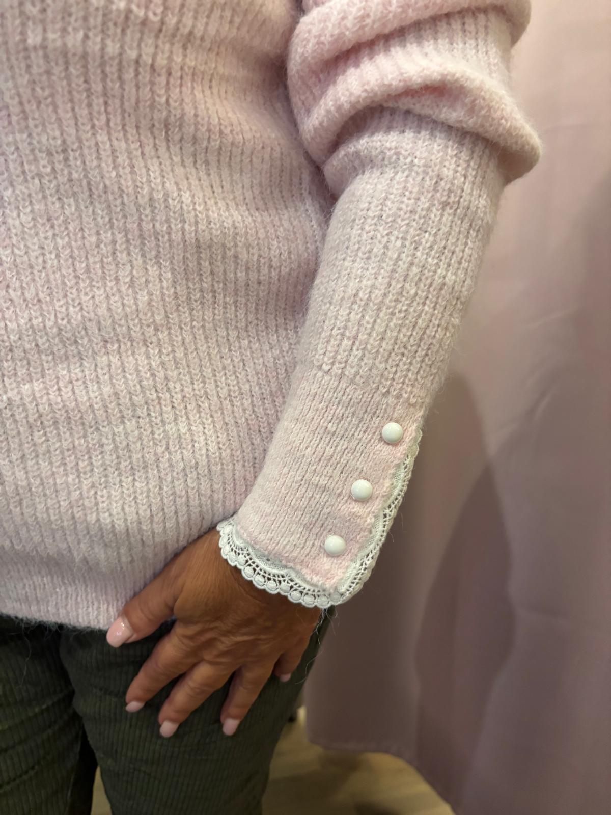 Suloinen neule pitsikoristeilla roosa